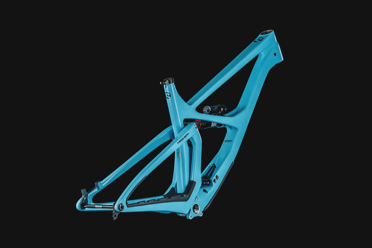 Mayhem 140 in Alpine Blue — Frame and rear triangle from the non-drive side, three-quarter view