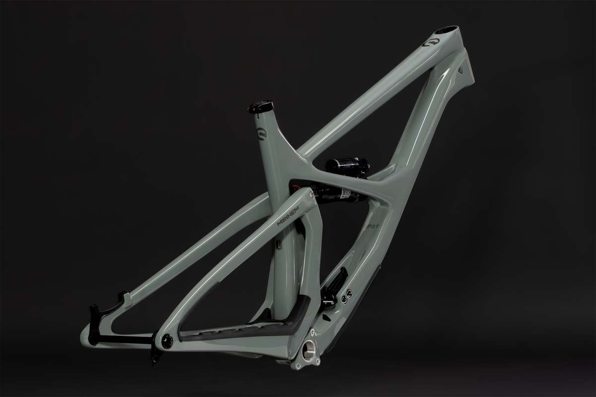 Mayhem 140 in Lichen Grey — Frame and rear triangle from the non-drive side, three-quarter view