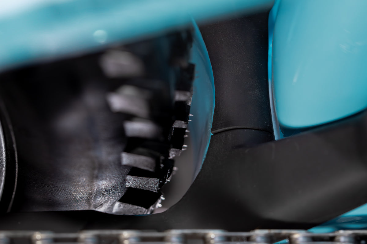 Mayhem 140 in Alpine Blue — Rear tire clearance at the seat tube, with the chain below