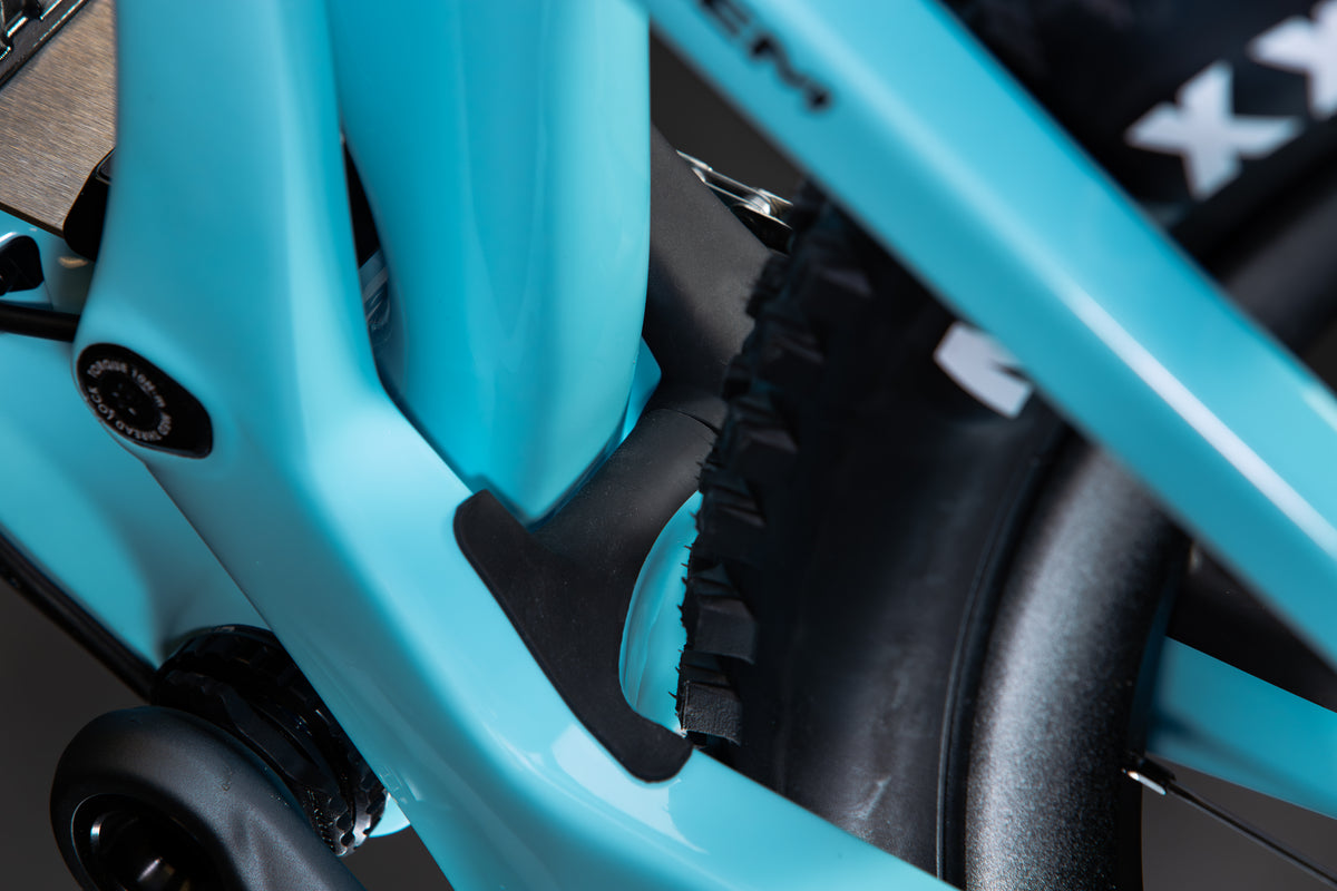 Mayhem 140 in Alpine Blue — Seat tube and chainstay yoke, with the rear tire