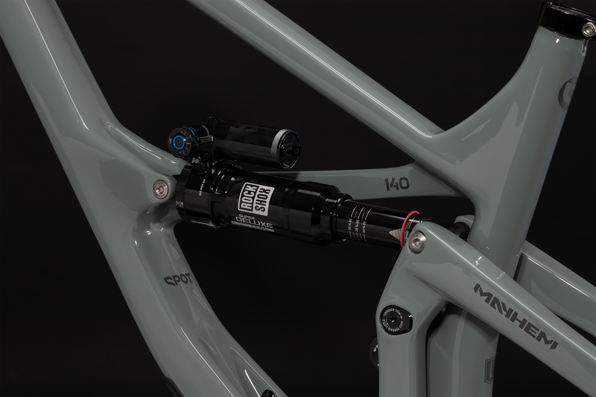 Mayhem 140 in Lichen Grey — Rear shock and rocker link seen through the front triangle