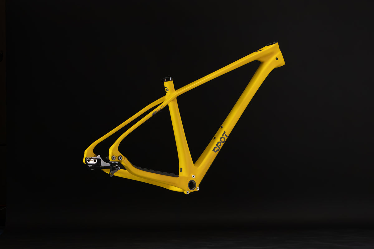 Rocker Carbon Gen 3 in Aspen Glow — Frame from the rear three-quarter angle