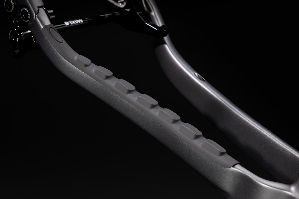 Rocker Carbon Gen 3 in Talus Grey — Drive-side chainstay with its moulded rubber protector