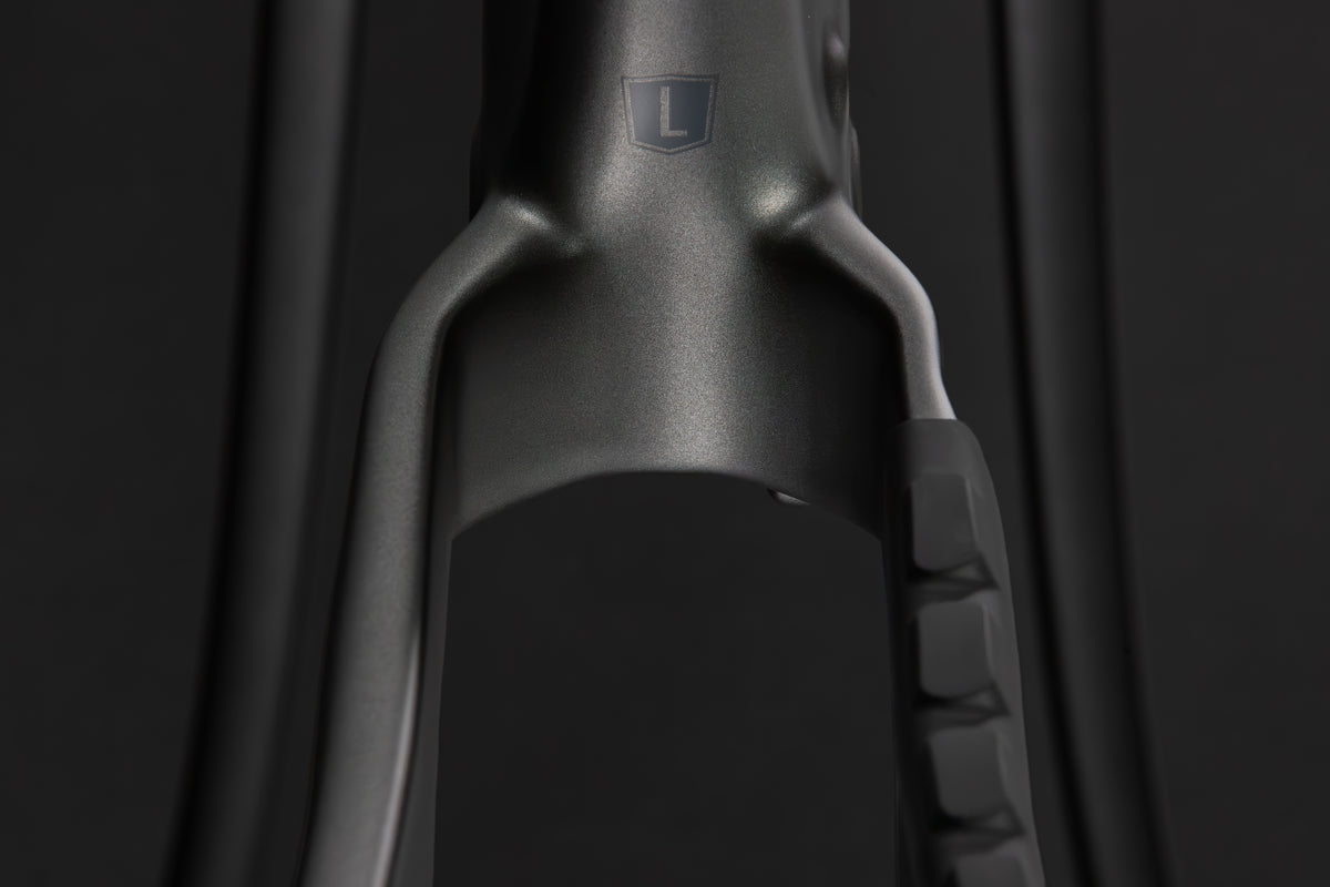 Rocker Carbon Gen 3 in Talus Grey — Tire clearance at the chainstay yoke behind the bottom bracket