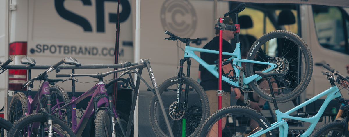 Spot bikes in repair stands on the shop floor in Golden, Colorado